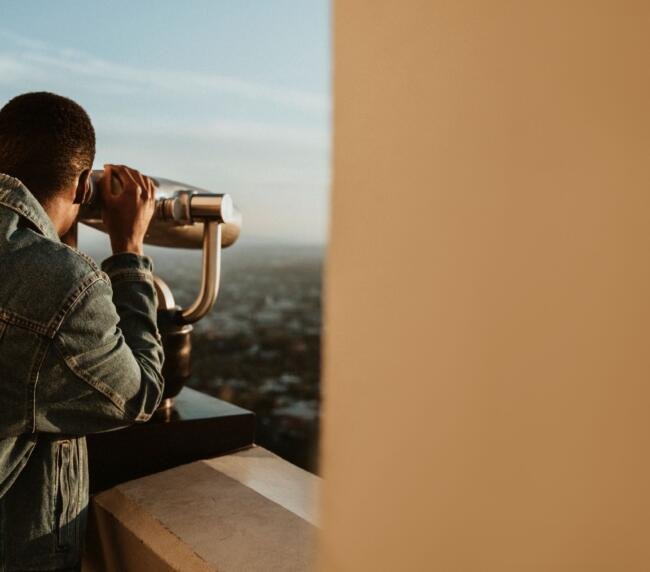man-using-telescope-2025-02-10-08-54-43-utc-scaled
